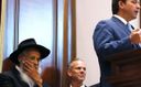 Rabbi Sholom Lipskar listens as Florida Gov. Ron DeSantis speaks during a press conference at the Shul of Bal Harbour on June 14, 2021 in Surfside, Florida. by the Forward
			