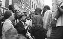 Then Mayor David Dinkins, center, looks on while a Jewish man and a Black man argue during riots in Crown Heights, August 1991. (New York Daily News Archive/Getty Images) by the Forward
			