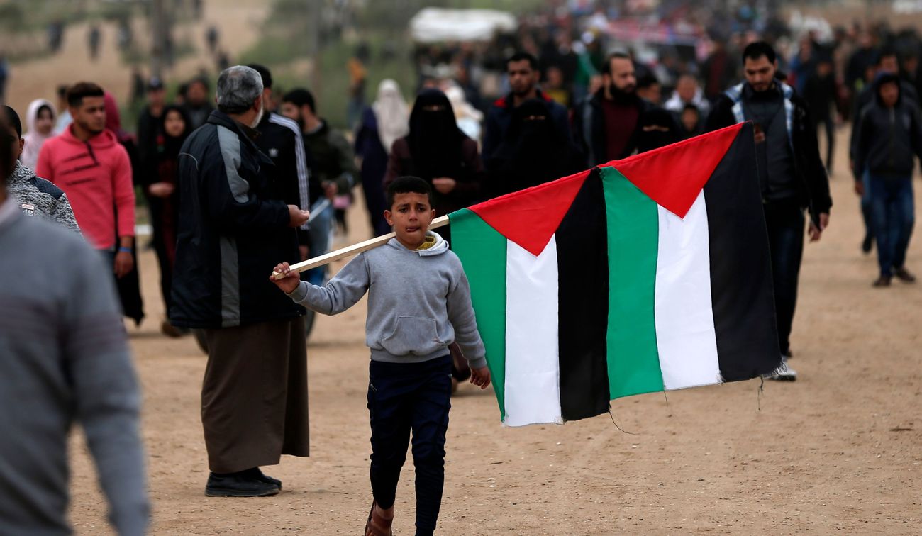 A Palestinian boy protesting Israel by the Forward
			