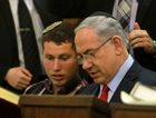 Israeli Prime Minister Benjamin Netanyahu and his son Avner read the book of Esther at Jerusalem's Great Synagogue on March 5, 2015 during the holiday of Purim. by the Forward