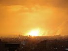 An explosion lights the sky following an Israeli air strike on Beit Lahia in the northern Gaza Strip on May 14, 2021. by the Forward
			