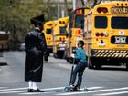 Young yeshiva student with his father in Brooklyn, New York by the Forward
			