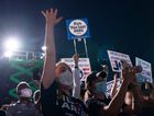 Supporters cheer as Joe Biden arrives for a drive-in campaign rally at the Florida State Fairgrounds on Oct 29,2020 in Tampa, Fl. by the Forward
			