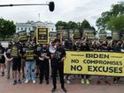 Members of the Sunrise Movement hold signs during a protest near the White House in Washington, D.C., U.S., on Friday, June 4, 2021. President Biden has pitched to Republicans the idea of a 15% minimum tax on U.S. corporations, along with strengthened IRS enforcement efforts, as a way to fund a bipartisan infrastructure package. Photographer: Shuran Huang/Bloomberg via Getty Images by the Forward
			