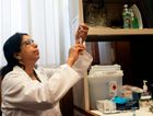 A nurse prepares the measles, mumps and rubella vaccine at the Rockland County Health Department in Haverstraw, Rockland County, New York. by the Forward