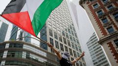 A person waves a Palestinian flag at a rally in support of the Palestinian people in New York City by the Forward
			