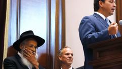 Rabbi Sholom Lipskar listens as Florida Gov. Ron DeSantis speaks during a press conference at the Shul of Bal Harbour on June 14, 2021 in Surfside, Florida. by the Forward
			