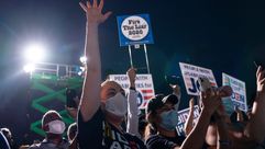 Supporters cheer as Joe Biden arrives for a drive-in campaign rally at the Florida State Fairgrounds on Oct 29,2020 in Tampa, Fl. by the Forward
			