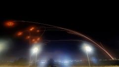 Iron Dome missiles intercept rockets fired from Gaza. by the Forward
			