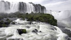 This is a partial view of the Devil's Throat at the Iguazu Falls, from the Brazilian side of the Iguazu River — waterfalls above a verdant landscape by the Forward
			