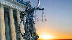 Lady Justice with scales outside SCOTUS building by the Forward
			