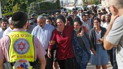 Mourners attend the funeral of a victim of the Lag B'omer tragedy atop Mount Meron. by the Forward
			
