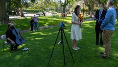 Rabbi Erez Sherman officiates the wedding of Bella Staav and Jonathan Sunshine in Holmby Park in Los Angeles. by the Forward
			