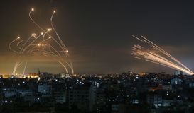 Rockets are seen in the night sky fired between Israel and Beit Lahia in the northern Gaza Strip on May 14, 2021 by the Forward
			