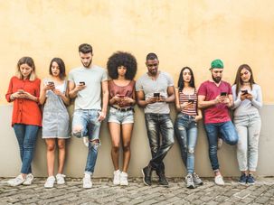 Looking at cell phones. by the Forward