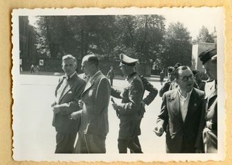 Staff of the Sobibor killing center on a field trip to Berlin. This photo shows Sobibor personnel with officials of the Führer chancellery. Johann Niemann is center. by the Forward
			