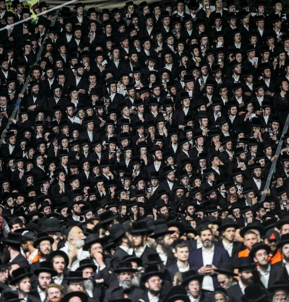 Ultra-Orthodox Jews gather at the grave site of Rabbi Shimon Bar Yochai at Mount Meron in northern Israel on April 29, 2021 as they celebrate the Jewish holiday of Lag BaOmer, marking the anniversary of the death of the Talmudic sage, approximately 1,900 years ago by the Forward
			