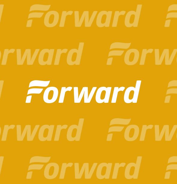 Peggy Walt's seder featured place settings for all those present, even if they couldn't quite sit in their assigned seats. by the Forward