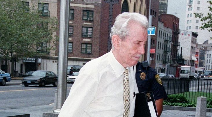 Jack Reimer, a Ukrainian immigrant accused of being a Nazi war criminal, enters Federal District Court in Manhattan on Aug. 17, 1998. He was later stripped of his U.S. citizenship and ordered deported, but died at his home in Fort Lee, New Jersey. (Stan Honda/AFP via Getty Images)