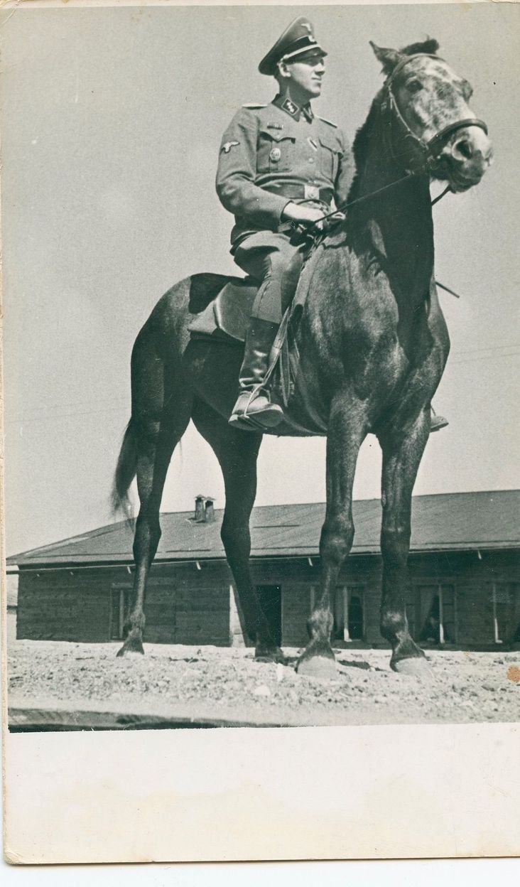 Johann Niemann posing on horseback on the arrival ramp at the Sobibor killing center, summer 1943.
