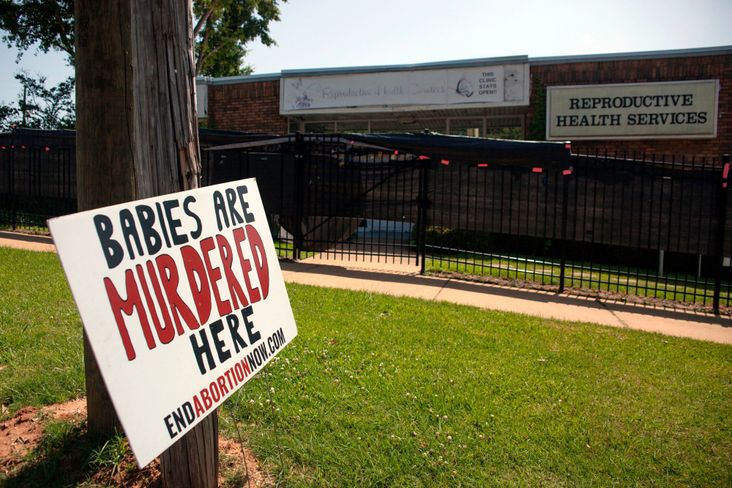 An anti-abortion sign is placed outside of the Reproductive Health Services building in Montgomery, Alabama.