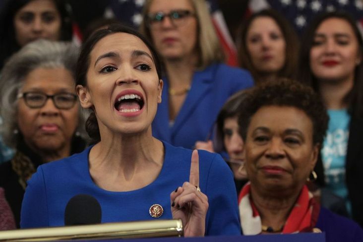 New York Rep. Alexandria Ocasio-Cortez speaks as other House Democrats listen during a news conference at the U.S. Capitol, January 30, 2019.