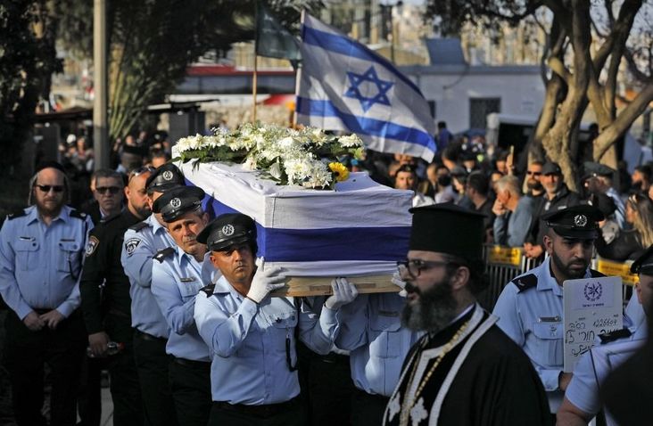 Israeli police officers carry coffin of Amir Khoury