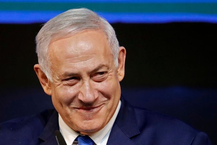 Israeli Prime Minister Benjamin Netanyahu smiles as he addresses supporters on election night at his Likud Party headquarters in Tel Aviv, April 10, 2019.