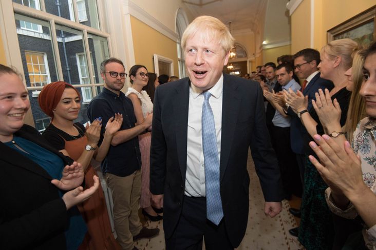 New Prime Minister Boris Johnson is welcomed by staff at Downing Street on July 24, 2019 in London.