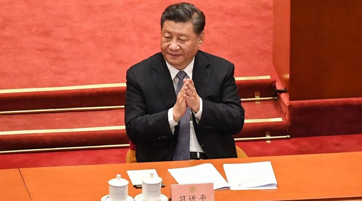 China's President Xi Jinping applauds during the opening ceremony of the Chinese People's Political Consultative Conference (CPPCC) at the Great Hall of the People in Beijing, March 4, 2022. (Matthew Walsh/ AFP via Getty Images)