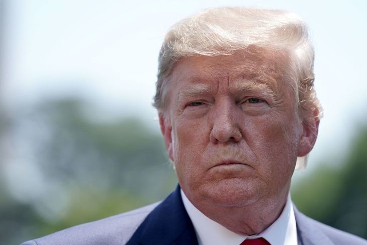 President Donald Trump talks to journalists after returning to the White House July 30, 2019.