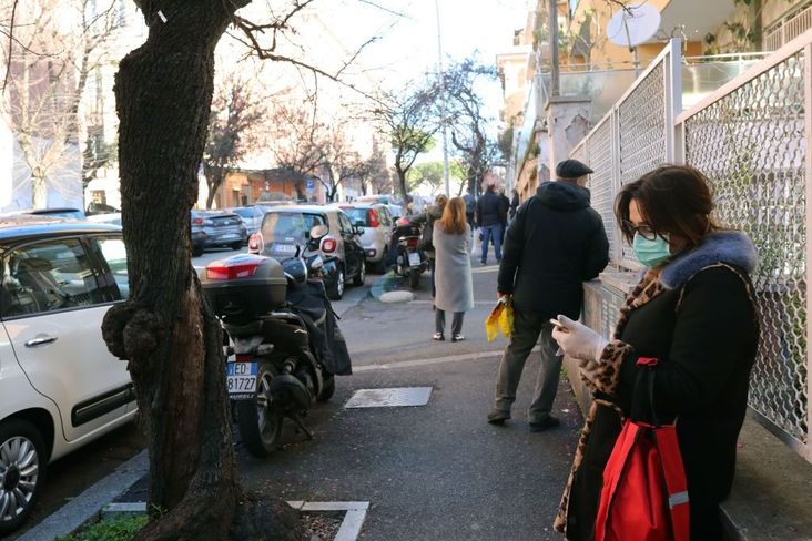 Supermarket customers are lined up waiting to enter a meter away from each other in the Monteverde Vecchio neighborhood on March 12, 2020 in Rome, Italy.