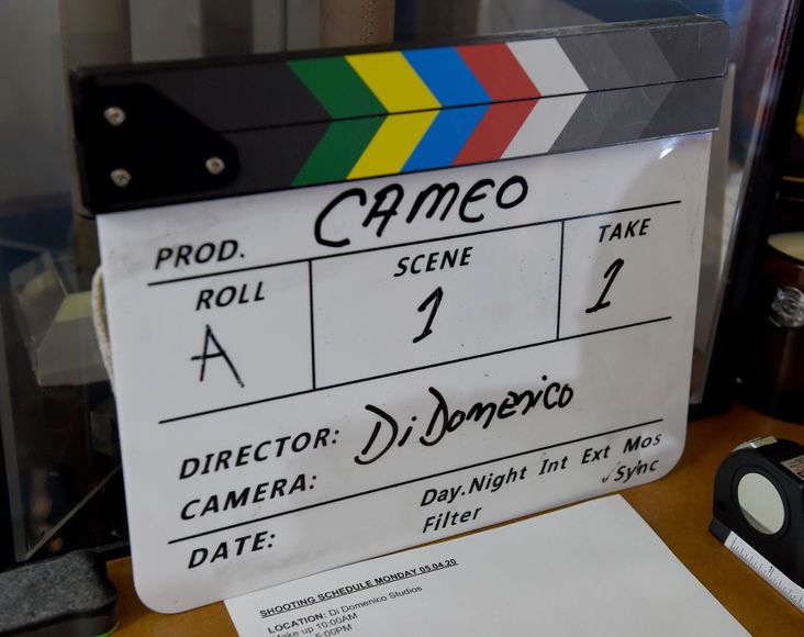 A clapperboard with the word "Cameo" on it.