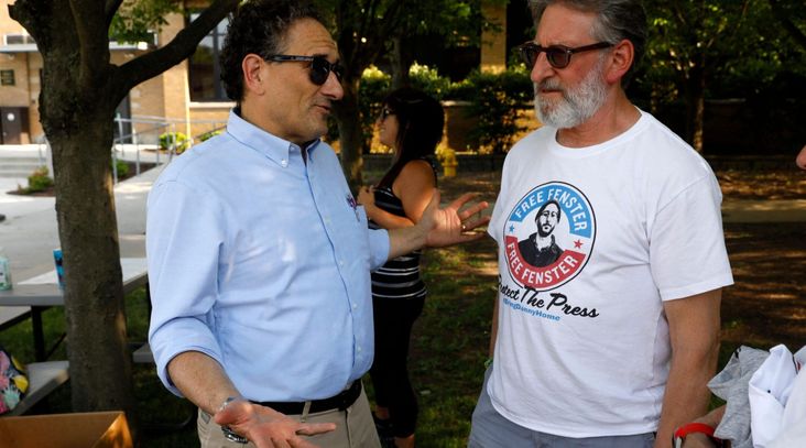 U.S. Rep. Andy Levin, left, talks to Buddy Fenster, father of detained journalist Danny Fenster, in Huntington Woods, Michigan, on June 4, 2021. Levin credited a determined Jewish community for helping secure Fenster's release in November 2021. (Jeff Kowalsky, AFP via Getty Images)