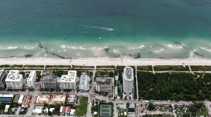 This aerial view shows search and rescue personnel working after the partial collapse of the Champlain Towers South in Surfside, north of Miami Beach, on June 24, 2021.