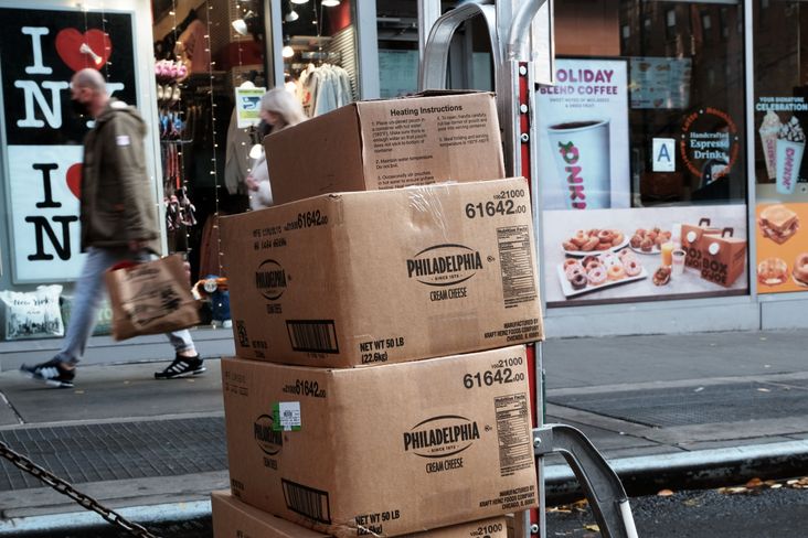 On the streets of New York, stacks of cream cheese boxes await delivery