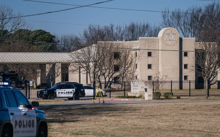 Law enforcement vehicles sit in front of the Congregation Beth Israel synagogue on January 16, 2022 in Colleyville, Texas.