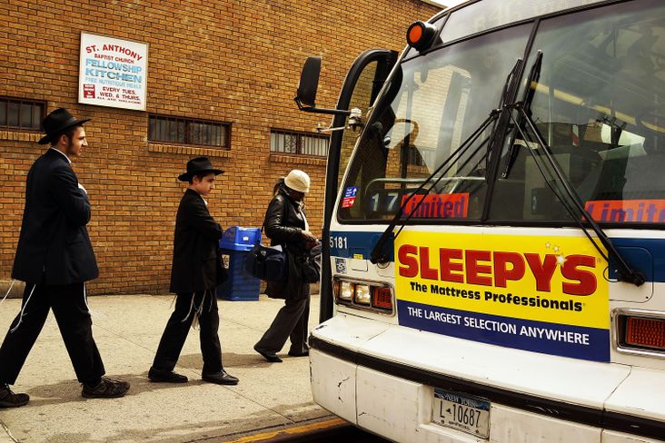 Haredi men board the bus