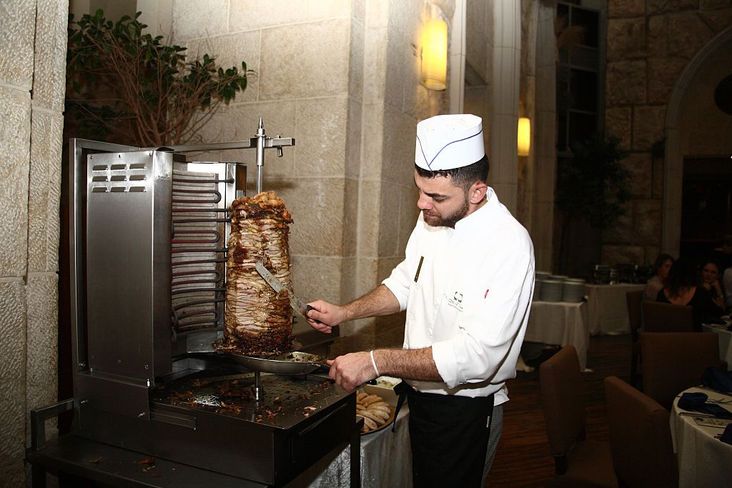 Serving shawarma in Jerusalem.