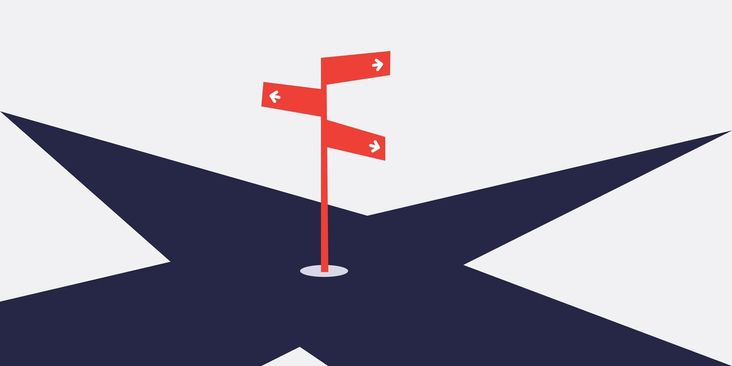 Signs at a crossroads point different directions.
