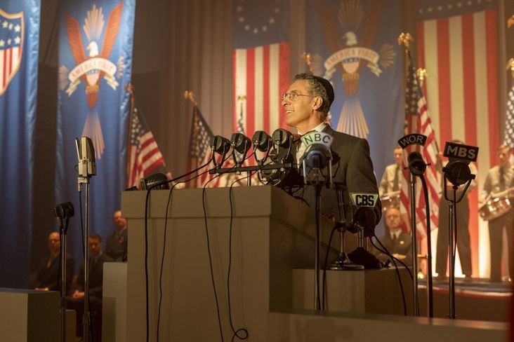 John Turturro as Rabbi Lionel Bengelsdorf in "The Plot Against America." Visible is an eagle design on the America First banners that resembles the one on the backs of one dollar bills.