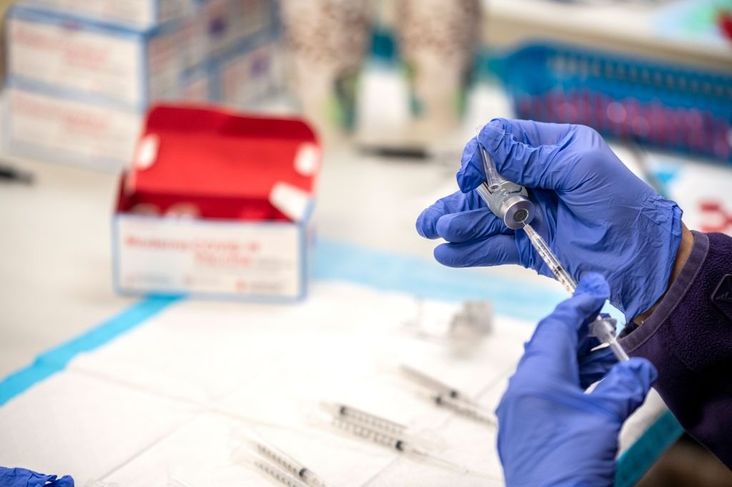 A nurse fills up a syringe with the Moderna Covid-19 vaccine at a vaccination site at a senior center on March 29, 2021 in San Antonio, Texas.
