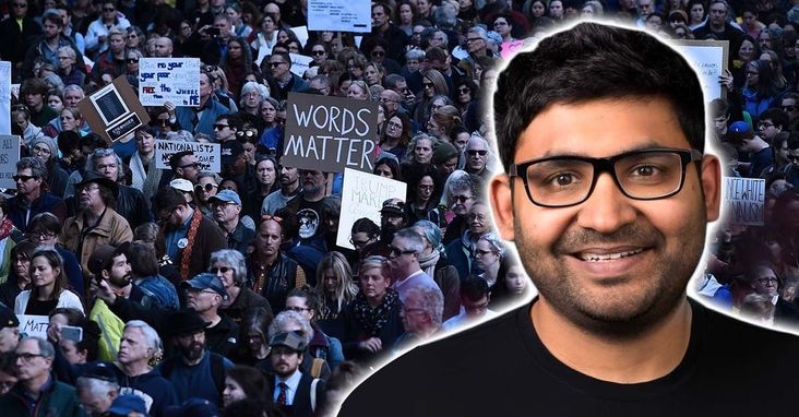 Twitter's new CEO, Parag Agarwal. Background: a protest after the deadly shooting in a Pittsburgh synagogue.