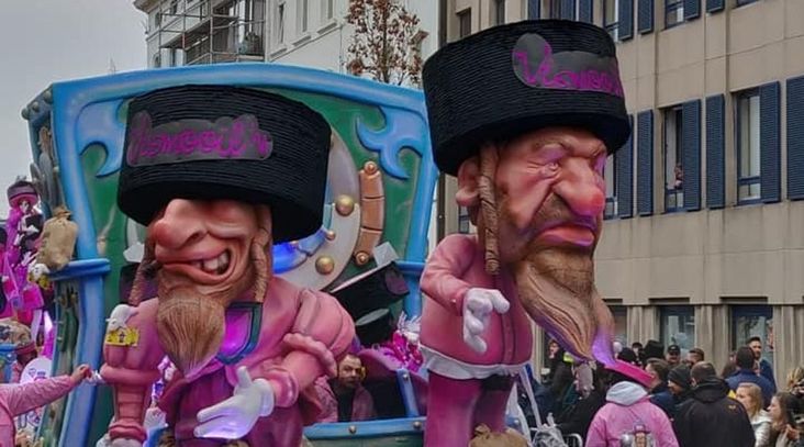 A parade float at the Aalst Carnaval in Belgium features caricatures of Orthodox Jews atop money bags, March 3, 2019.