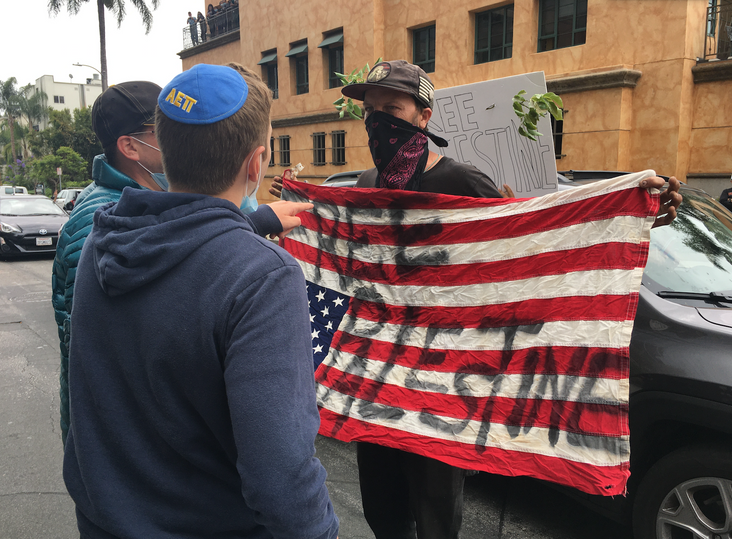 A young man in an AEPi kipa confronts a pro-Palestine protester at anti-annexation rally July 1 in Los Angeles.