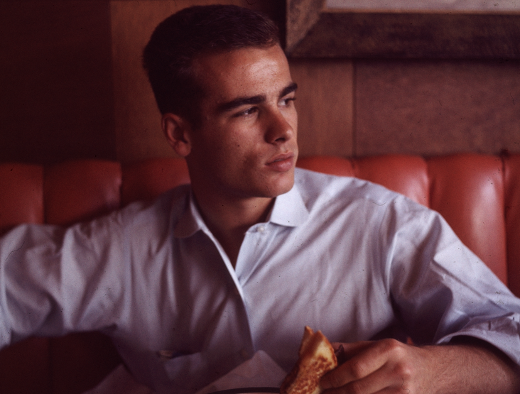 Dean Stockwell at a diner, consuming a grilled cheese sandwich