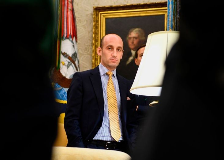 White House senior advisor Stephen Miller looks on as President Donald Trump speaks to the media in the Oval Office, July 26, 2019.