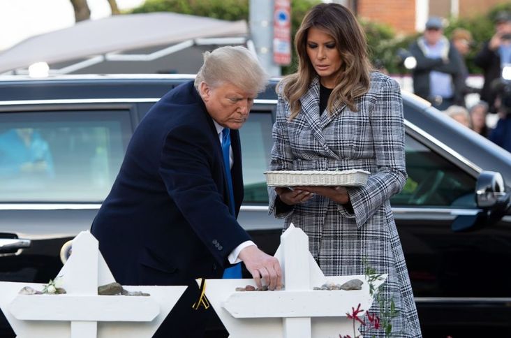 President Trump and First Lady Melania Trump place stones and flowers on a memorial as they pay their respects at the Tree of Life Synagogue in Pittsburgh, Pennsylvania following a shooting, October 30, 2018.