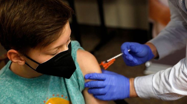 Aiden Arthurs receives the Pfizer-BioNTech Covid-19 Vaccine at the Jewish Federation/JARC's offices in Bloomfield Hills, Michigan, May 13, 2021. (Jeff Kowalsky/AFP via Getty Images)